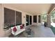 Covered patio with comfortable seating, perfect for enjoying outdoor living and entertaining at 7272 W Crystal Rd, Glendale, AZ 85308