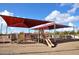 Community playground featuring a slide and sunshade with picnic tables, a perfect space for outdoor fun and recreation at 7272 W Crystal Rd, Glendale, AZ 85308