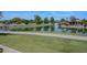 Picturesque pond with a walking path and lush green surroundings creates a relaxing community atmosphere at 7272 W Crystal Rd, Glendale, AZ 85308