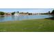 Scenic pond with a fountain and views of the surrounding community offering a serene and picturesque setting at 7272 W Crystal Rd, Glendale, AZ 85308