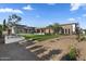 Beautiful backyard with lush landscaping, a modern home design, and an inviting outdoor pool at 7341 E Sunnyside Dr, Scottsdale, AZ 85260