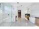 Stylish bathroom with a glass shower, double vanity, soaking tub, and modern tile flooring at 7341 E Sunnyside Dr, Scottsdale, AZ 85260