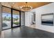 Elegant entryway with marble floors, a wood ceiling, a statement chandelier, and views of the landscaped front yard at 7341 E Sunnyside Dr, Scottsdale, AZ 85260