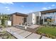 Modern home featuring desert landscaping, brick accents, a cozy seating area, and a meticulously designed walkway at 7341 E Sunnyside Dr, Scottsdale, AZ 85260