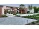 Beautiful home exterior featuring modern design elements and desert landscaping including cacti and wildflowers at 7341 E Sunnyside Dr, Scottsdale, AZ 85260