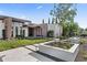 Modern home showcasing desert landscaping, manicured lawn, and geometric design with stone pathways and elegant plantings at 7341 E Sunnyside Dr, Scottsdale, AZ 85260