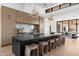 Modern kitchen with a large center island, seating, and stylish lighting at 7341 E Sunnyside Dr, Scottsdale, AZ 85260