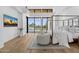 Brightly lit main bedroom with backyard view, decorative rug, and cozy furniture at 7341 E Sunnyside Dr, Scottsdale, AZ 85260