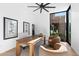 Bright home office with a large wooden desk, comfortable chairs, and natural light at 7341 E Sunnyside Dr, Scottsdale, AZ 85260