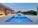 Luxury backyard with a large pool, spa, outdoor kitchen, and a beautifully landscaped garden at 7341 E Sunnyside Dr, Scottsdale, AZ 85260