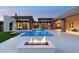 Beautiful pool area with a modern fire pit and multiple views into the home at 7341 E Sunnyside Dr, Scottsdale, AZ 85260