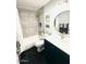 The bathroom features a shower and tub combo with black tile floors at 7409 N Via Camello Del Norte -- # 138, Scottsdale, AZ 85258