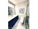 Stylish bathroom featuring modern vanity, toilet, framed photos, and glass-enclosed shower at 7409 N Via Camello Del Norte -- # 138, Scottsdale, AZ 85258