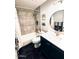 Cozy bathroom featuring vanity with storage, sink, mirror, modern fixtures and shower with grey tile at 7409 N Via Camello Del Norte -- # 138, Scottsdale, AZ 85258