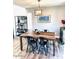 Contemporary dining room with wooden table, modern chairs, unique light fixture, and stylish decor at 7409 N Via Camello Del Norte -- # 138, Scottsdale, AZ 85258