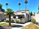 Well-maintained exterior of a home with a stucco wall, palm trees, and desert landscaping at 7409 N Via Camello Del Norte -- # 138, Scottsdale, AZ 85258