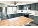 Well-appointed kitchen with stainless steel appliances, gray cabinetry, and quartz countertops at 7409 N Via Camello Del Norte -- # 138, Scottsdale, AZ 85258
