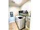 Functional laundry room equipped with a white washer and dryer and shelving for storage at 7409 N Via Camello Del Norte -- # 138, Scottsdale, AZ 85258