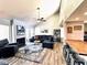 Bright living room featuring a ceiling fan, fireplace, hardwood floors, and comfortable seating at 7409 N Via Camello Del Norte -- # 138, Scottsdale, AZ 85258
