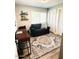 This home office has a nice area rug and comfortable seating at 7409 N Via Camello Del Norte -- # 138, Scottsdale, AZ 85258