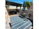 Relaxing outdoor patio with comfortable seating, shaded pergola, and stylish outdoor rug at 7409 N Via Camello Del Norte -- # 138, Scottsdale, AZ 85258
