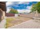 This home features a spacious backyard with brick pavers and a shed at 7755 W Cora Ln, Phoenix, AZ 85033