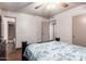 Bedroom featuring tile floors and standard closet doors at 7755 W Cora Ln, Phoenix, AZ 85033