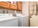 This home features a laundry room with a washer and dryer at 7755 W Cora Ln, Phoenix, AZ 85033