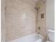 Updated bathroom with tiled shower-tub combo and stylish fixtures at 7830 E Valley Vista Dr, Scottsdale, AZ 85250