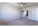 Bright bedroom with mirrored closet doors and neutral carpeting at 7830 E Valley Vista Dr, Scottsdale, AZ 85250