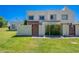 Inviting curb appeal with lush green lawn and a charming exterior featuring a private gated entrance at 7830 E Valley Vista Dr, Scottsdale, AZ 85250