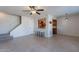 Bright and airy living area with tile floors, staircase and view to the kitchen with breakfast bar at 7830 E Valley Vista Dr, Scottsdale, AZ 85250