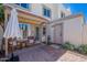 Charming outdoor patio with brick pavers, seating, and a shady umbrella for relaxing and entertaining at 7830 E Valley Vista Dr, Scottsdale, AZ 85250