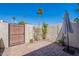 Private brick-paved patio with secure fencing, potted plants and space for outdoor furniture at 7830 E Valley Vista Dr, Scottsdale, AZ 85250