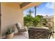 Relaxing balcony seating area with an outdoor view of the community at 7887 N 16Th St # 226, Phoenix, AZ 85020