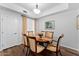 Bright dining room with a chandelier, modern window coverings, and a classic wood table at 7887 N 16Th St # 226, Phoenix, AZ 85020