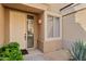 Inviting front entryway with a decorative door, side window and manicured shrubbery at 7887 N 16Th St # 226, Phoenix, AZ 85020