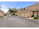 Street view of attached garages and individual entrances to townhomes in a gated community at 7887 N 16Th St # 226, Phoenix, AZ 85020