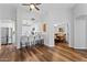 Open layout showcasing a kitchen and dining area with hardwood floors and a ceiling fan at 7887 N 16Th St # 226, Phoenix, AZ 85020