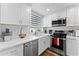 Well-appointed kitchen features white cabinetry, stainless appliances and modern fixtures at 7887 N 16Th St # 226, Phoenix, AZ 85020