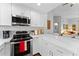 Updated kitchen with white cabinets, a stainless dishwasher, and a stainless oven at 7887 N 16Th St # 226, Phoenix, AZ 85020