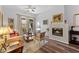 Bright living room boasts hardwood floors, natural light, and a cozy fireplace at 7887 N 16Th St # 226, Phoenix, AZ 85020