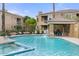 Large, inviting community pool area with a waterfall feature and a hot tub at 7887 N 16Th St # 226, Phoenix, AZ 85020