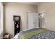 Neutral toned bedroom showcasing a view of closet and door, providing storage solutions and private access at 7930 W Wescott Dr, Glendale, AZ 85308