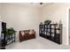 Versatile bonus room featuring carpet, neutral walls and built-in shelving for storage and display at 7930 W Wescott Dr, Glendale, AZ 85308
