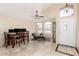 Elegant entryway featuring travertine floors, a modern ceiling fan, and arched windows that bring in natural light at 7930 W Wescott Dr, Glendale, AZ 85308