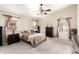 This carpeted main bedroom is illuminated by natural light and features a ceiling fan at 7930 W Wescott Dr, Glendale, AZ 85308