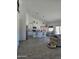 Bright, open-concept living space with modern kitchen, dining area, and comfortable seating at 8678 S John Jacob Astor Ave, Casa Grande, AZ 85193
