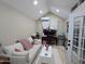 Relaxing living room with vaulted ceiling, sofa, desk and monitors with natural light at 8678 S John Jacob Astor Ave, Casa Grande, AZ 85193