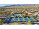 Community aerial view featuring well-kept tennis courts, pool, and desert landscaping with mountain views at 9265 N 115Th St, Scottsdale, AZ 85259